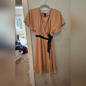 Elegant Tan Wrap Dress with Black Accent